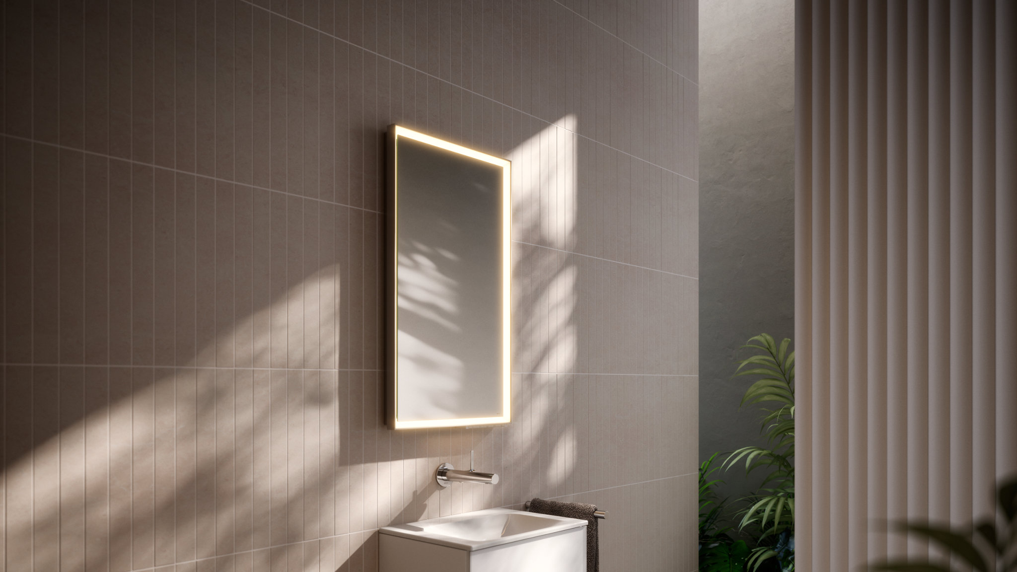 Side view of guest bathroom with ROYAL LUMOS light mirror, X-LINE vanity unit, IXMO mixer fitting and REVA Accessories