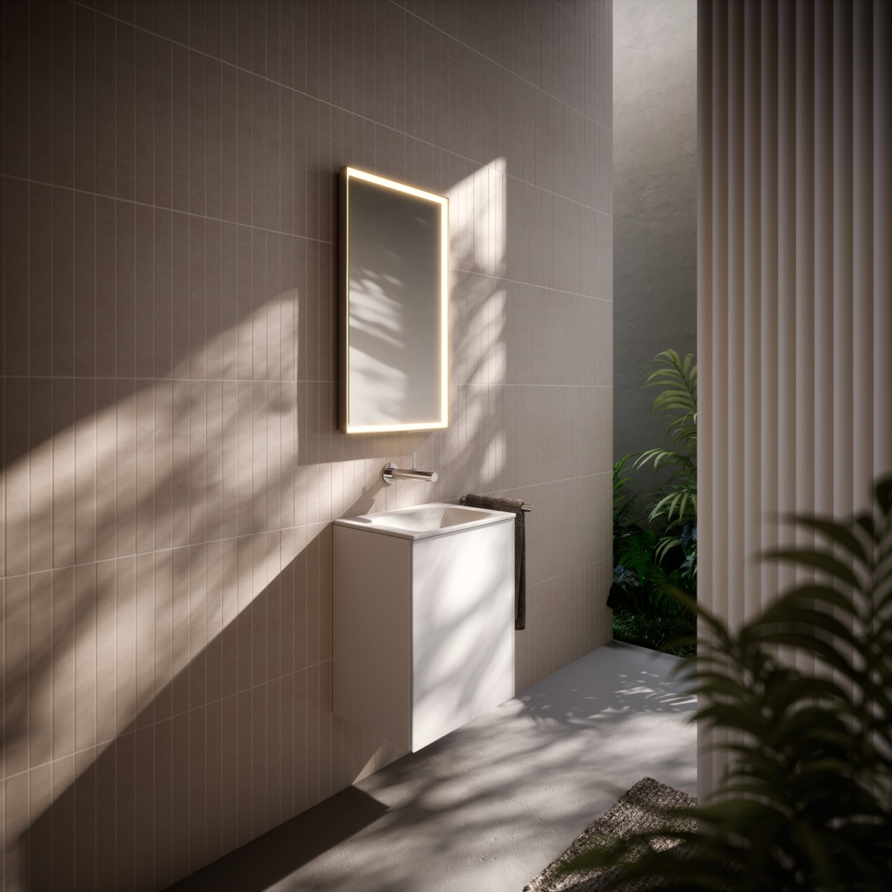 Gästebad in seitlicher Ansicht mit ROYAL LUMOS Lichtspiegel, X-LINE Waschtischunterbau, IXMO Armatur und REVA Accessoires