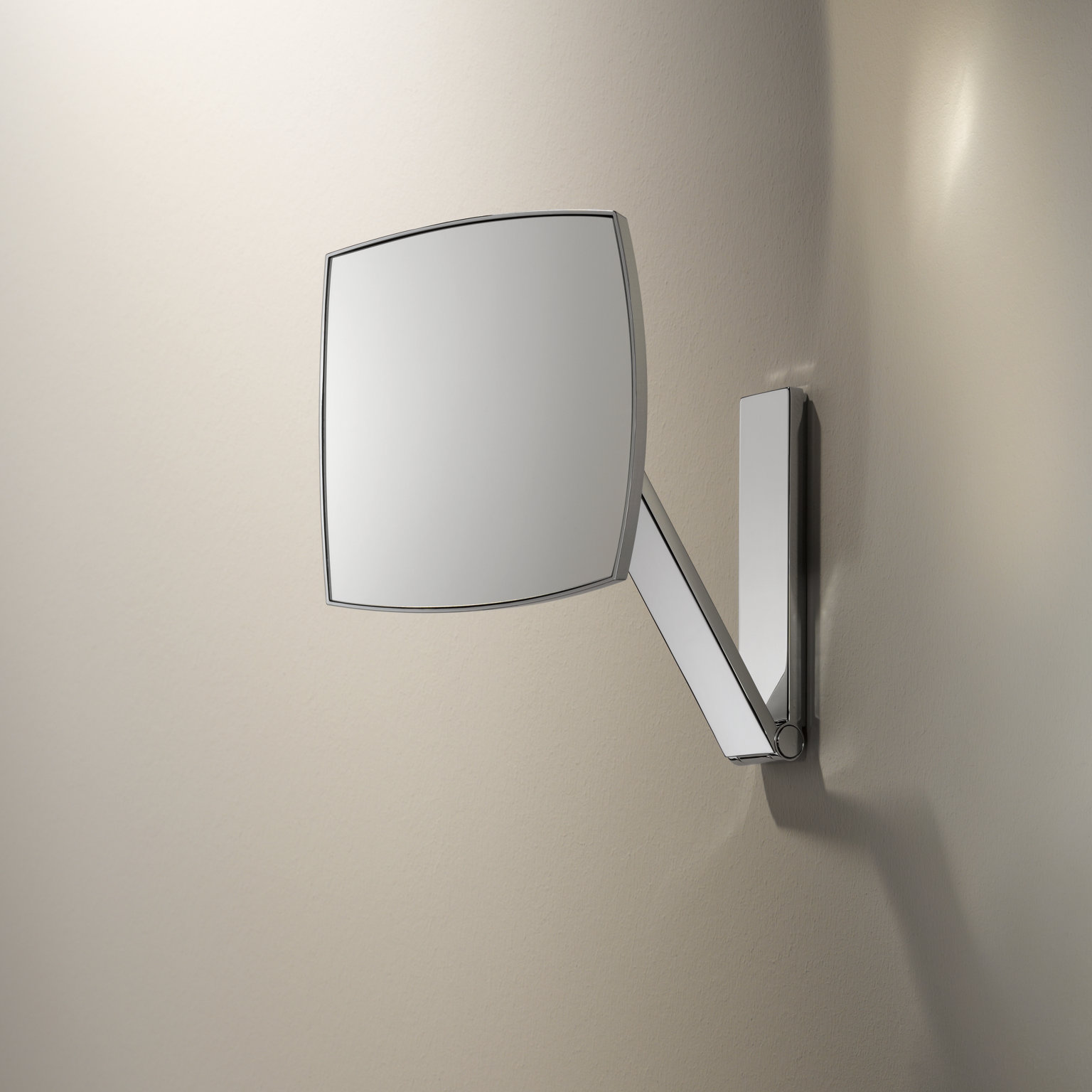 The square, unlit iLook_move cosmetic mirror is mounted on the wall