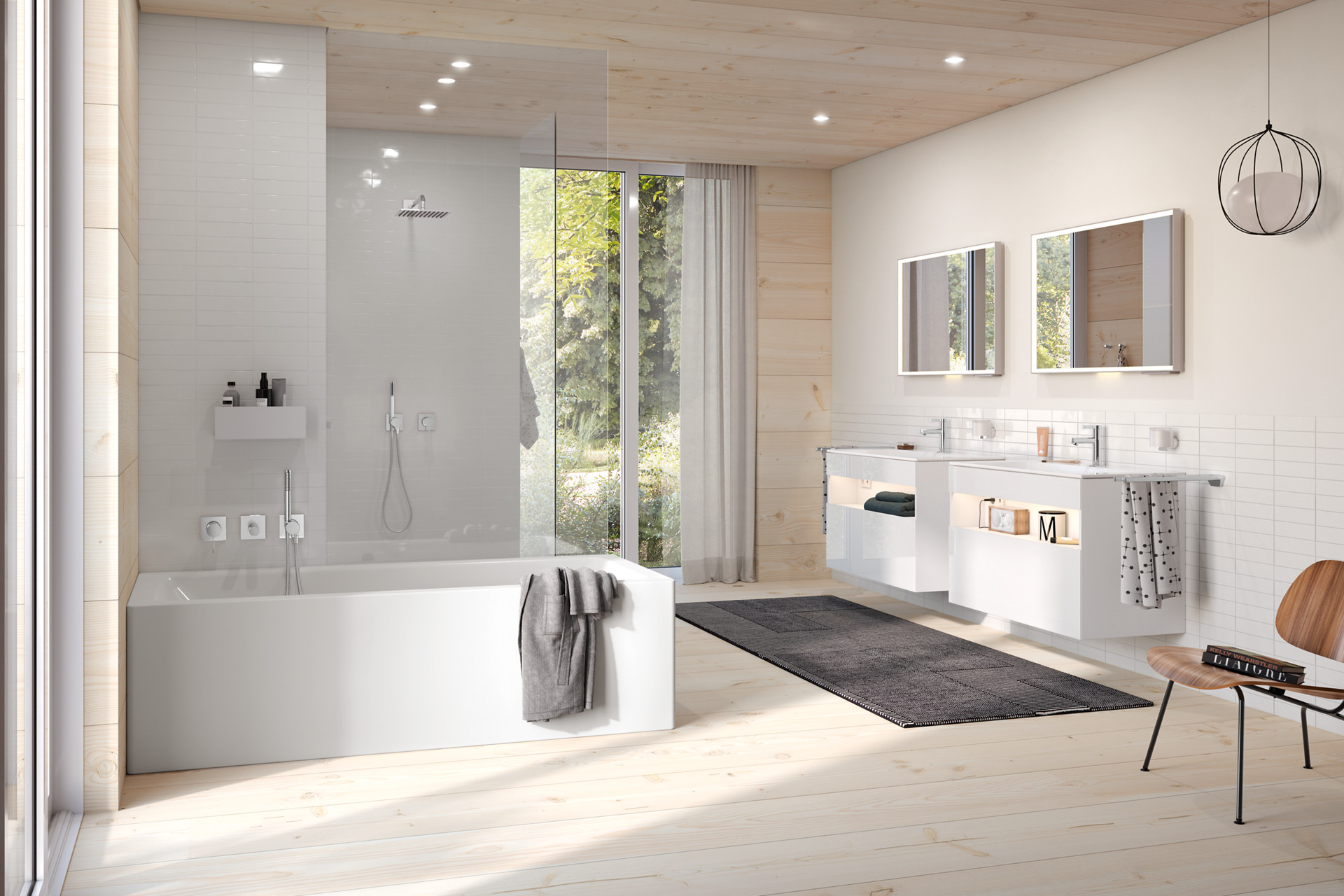 Badewanne und Duschbereich mit IXMO Armaturen sowie Stageline Waschtischunterschränke und Royal Lumos Lichtspiegel