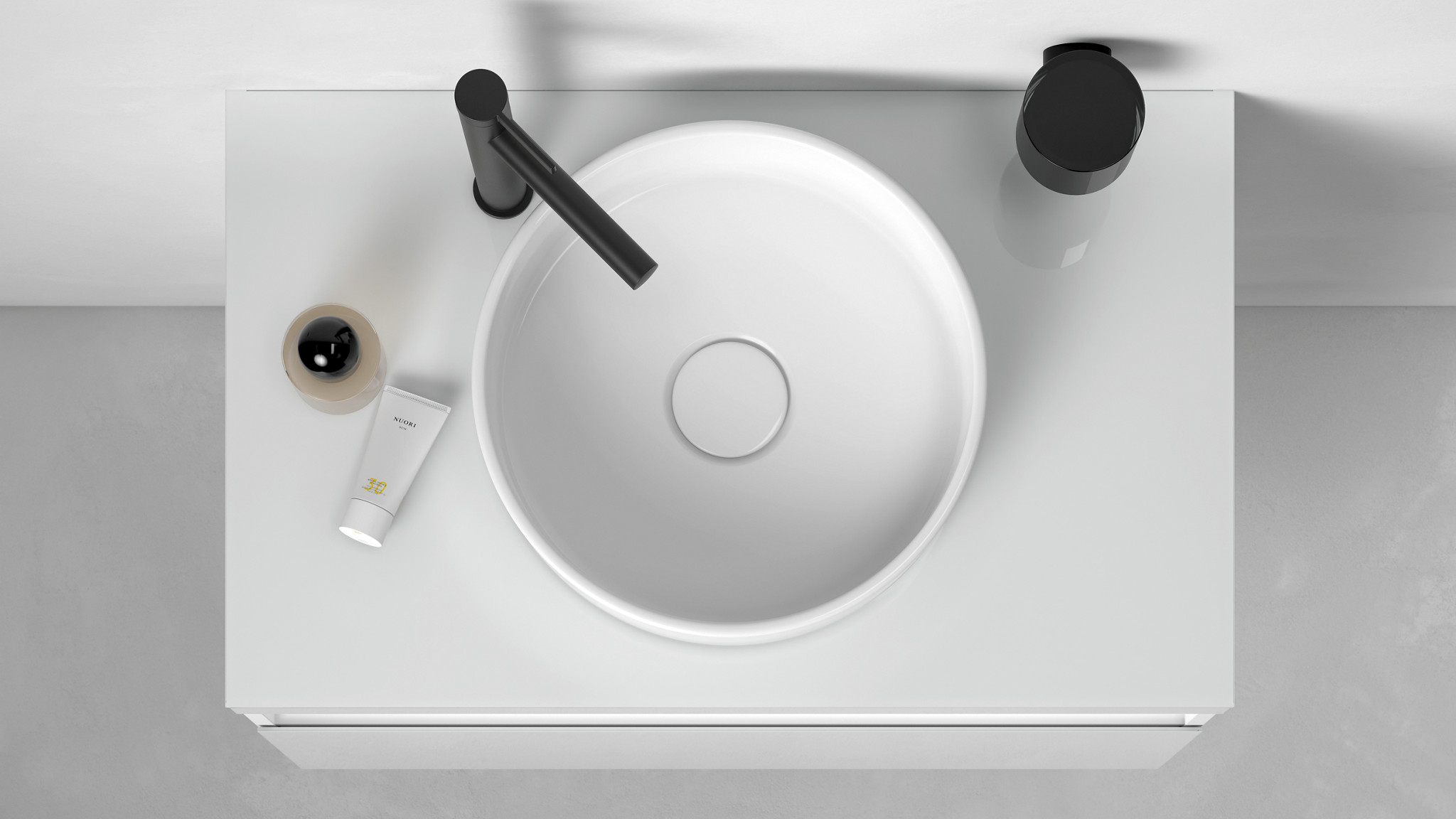 Einhebel-Waschtischmischer IXMO Pure in Schwarz auf rundem Stageline Waschtisch in Aufsicht