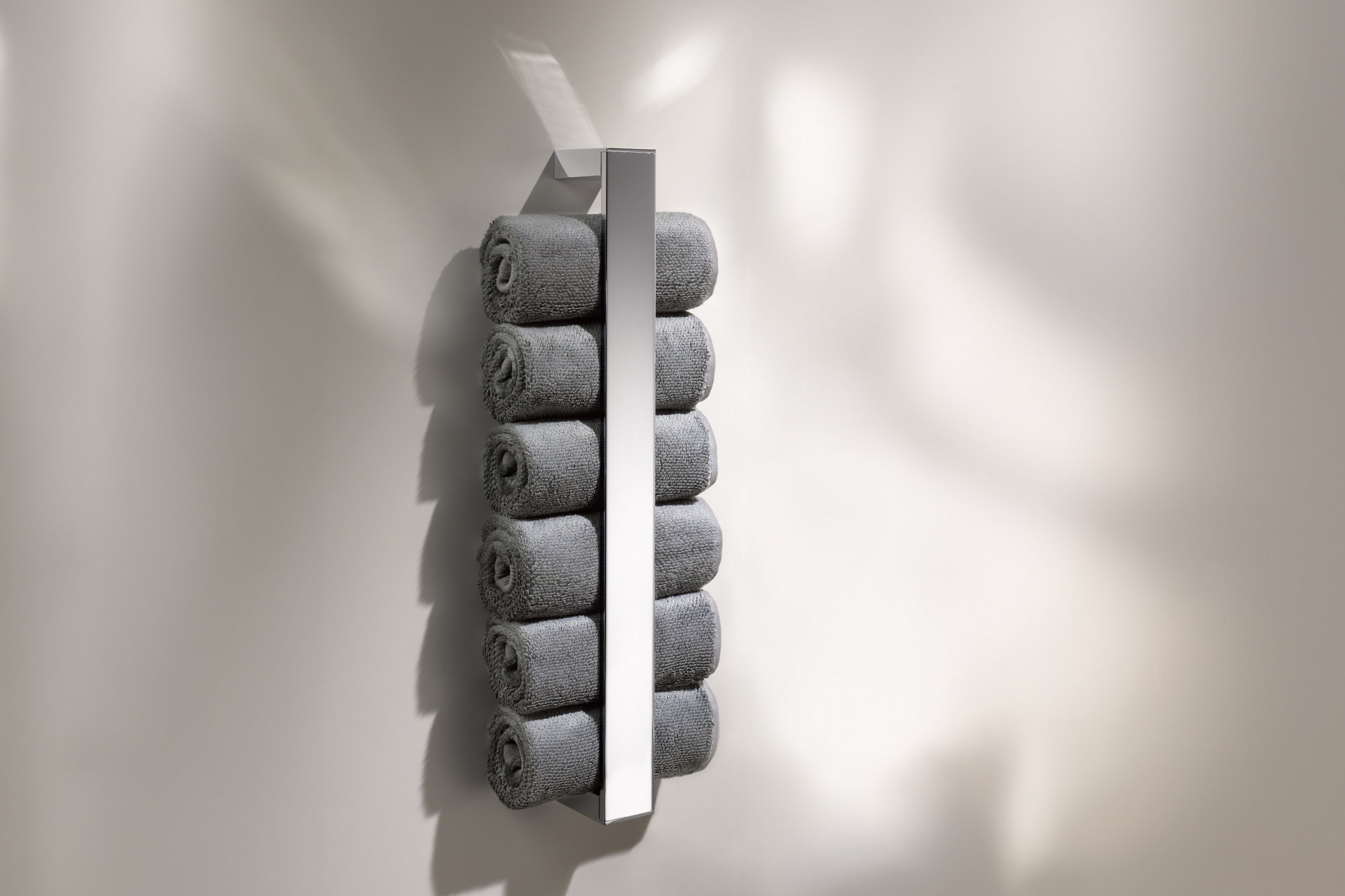 Edition 11 towel holder with towels and guest towel basket